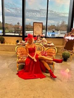 Theodora in a red gown at the Fête Minuet in Winter Park