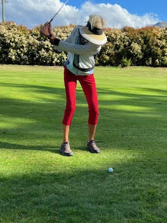 Theodora playing golf at Queenstown Golf New Zealand