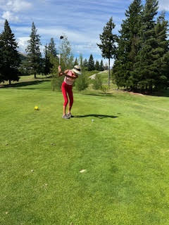 Theodora playing golf at Queenstown Golf New Zealand