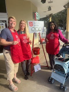 Theodora volunteers at Salvation Army ringing the famous Salvation Army Bell
